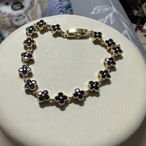 Gold-Tone Bracelet with Black Flower Accents
